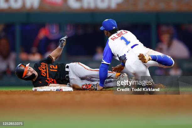 Adam Frazier of the Baltimore Orioles is caught stealing second by Ozzie Albies of the Atlanta Braves during the sixth inning at Truist Park on May...