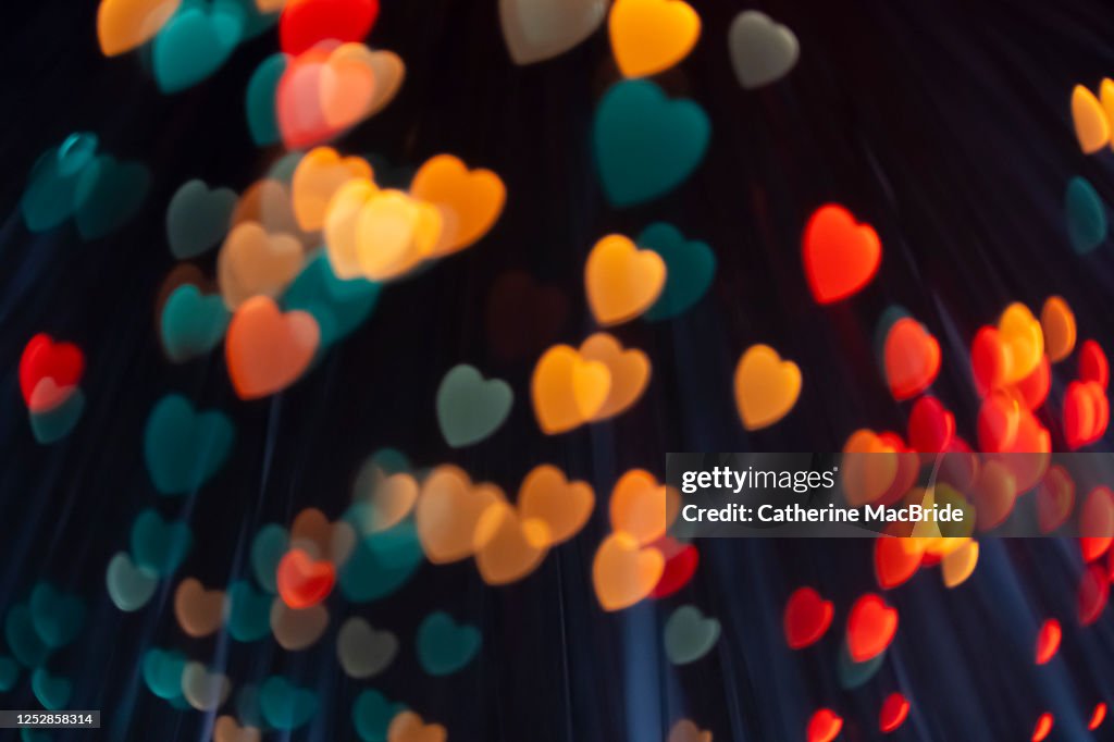 Pink heart shaped light bokeh