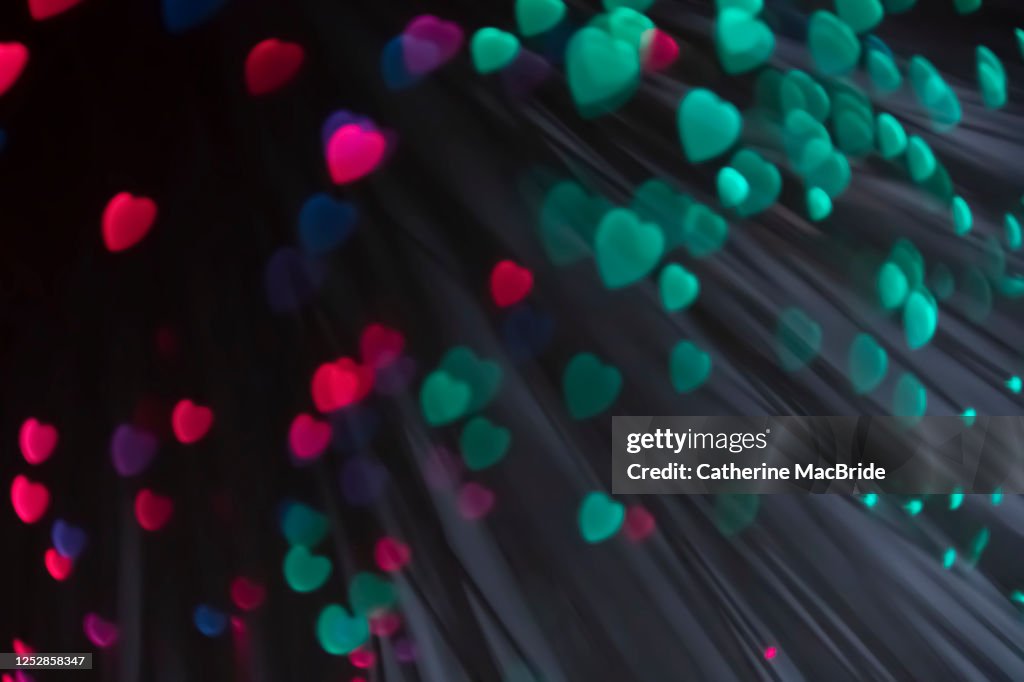 Pink heart shaped light bokeh