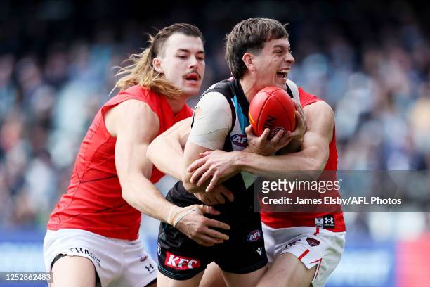 Sam Draper of the Bombers tackles Zak Butters of the Power during the 2023 AFL Round 08 match between the Port Adelaide Power and the Essendon...