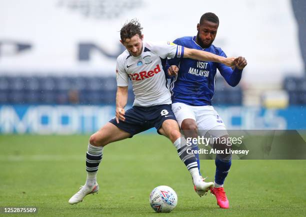 Alan Browne of Preston North End holds off a challenge from Junior Hoilett of Cardiff City during the Sky Bet Championship match between Preston...