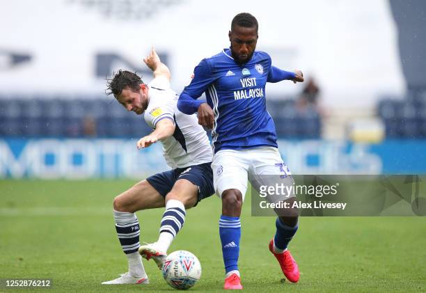 Alan Browne of Preston North End is tackled by Junior Hoilett of Cardiff City during the Sky Bet Championship match between Preston North End and...