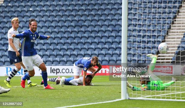 Joe Ralls of Cardiff City beats the dive of Declan Rudd of Preston North End with a header to score the opening goal during the Sky Bet Championship...