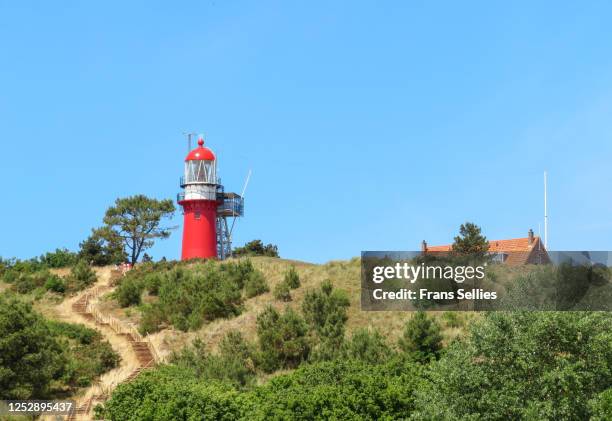 the lighthouse vuurduin on vlieland, one of the dutch wadden islands - vlieland stock pictures, royalty-free photos & images