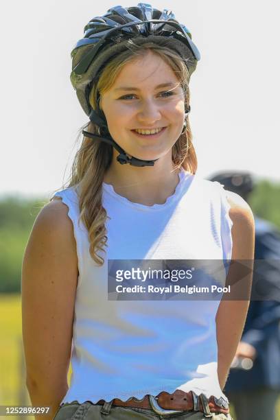 Princess Elisabeth of Belgium smiles during a visit with King Philippe of Belgium, Queen Mathilde of Belgium, Prince Gabriel of Belgium, Prince...