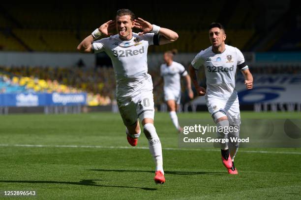 Ezgjan Alioski of Leeds United celebrates with teammate Pablo Hernandez after scoring his sides second goal during the Sky Bet Championship match...