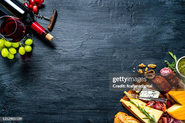 traditional spanish tapas and wine frame on dark background. copy space - food table edge stock pictures, royalty-free photos & images