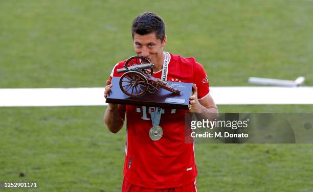 Robert Lewandowski of Bayern Muenchen is seen with the scorer king trophy during the Bundesliga match between VfL Wolfsburg and FC Bayern Muenchen at...