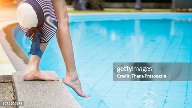 getting a feel for the wate - dip toe stock pictures, royalty-free photos & images