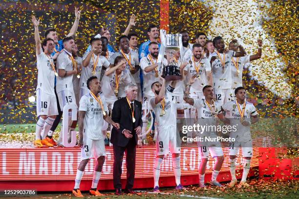 Real Madrid by the hand of its captain, Karim Benzema of Real Madrid lifts the champion's trophy during the Final Copa Rey match between Real Madrid...