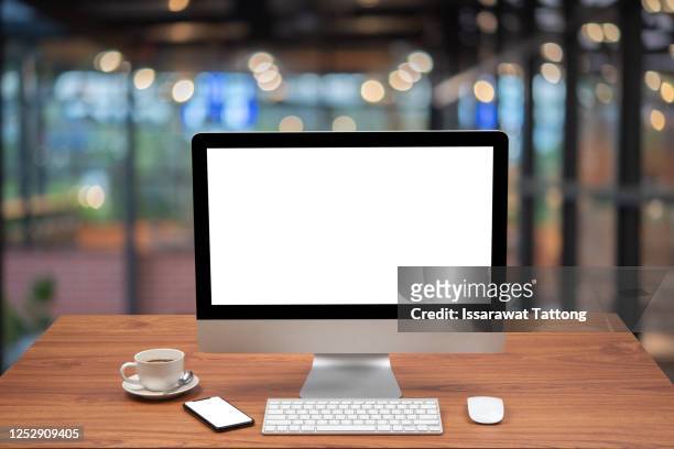 computer with blank screen and smartphone on table. - computer mouse table stock pictures, royalty-free photos & images