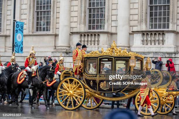 King Charles III and Queen Camilla are going to Westminster Abbey at the Golden carriage. Great Britain is very excited because of the King Charles...