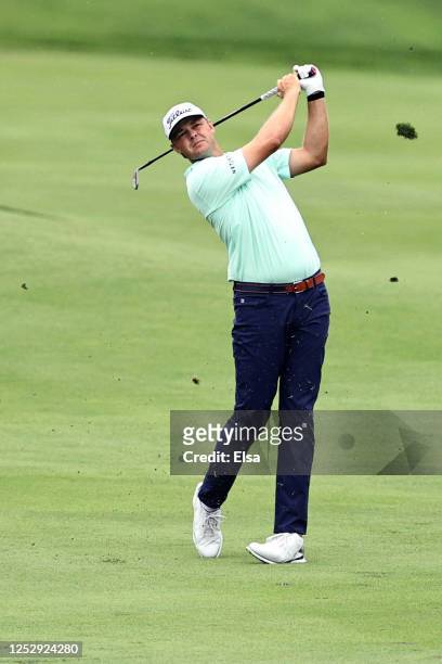 Patton Kizzire of the United States plays a shot on the 18th hole during the third round of the Travelers Championship at TPC River Highlands on June...