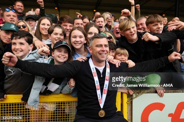 Steven Schumacher the manager / head coach of Plymouth Argyle with Plymouth Argyle fans as they celebrate being crowned champions of EFL Sky Bet...