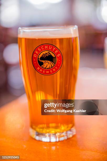 Glass of IPA beer at the Deschutes Brewery in the Old Town Historic District in Bend, Oregon, United States.