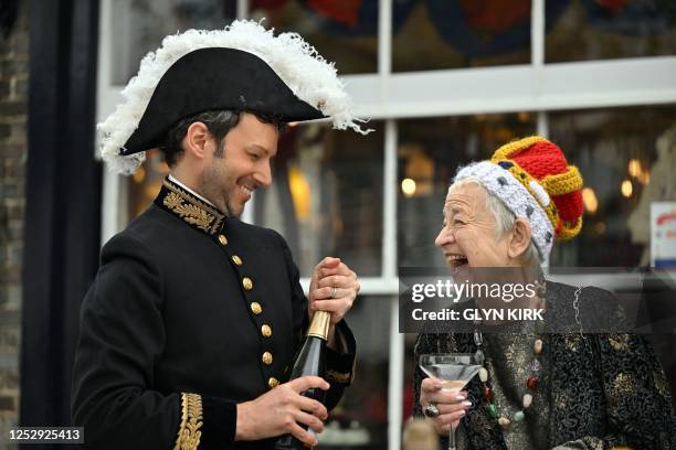 Residents participate in the Coronation Big Lunch, in Alfriston, southern England, on May 7, 2023. - Thousands of local street parties took place on...