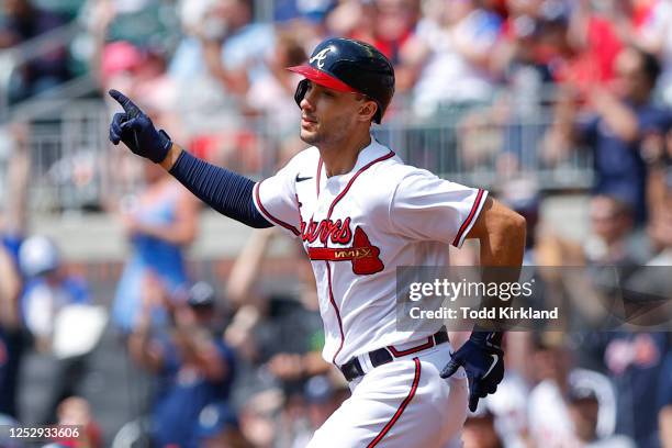 Matt Olson of the Atlanta Braves reacts after hitting a solo home run during the first inning against the Baltimore Orioles at Truist Park on May 7,...