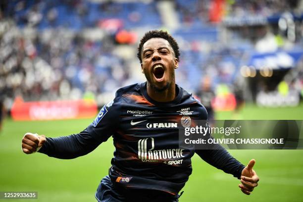 Montpellier's French forward Elye Wahi celebrates scoring his team's first goal during the French L1 football match between Olympique Lyonnais and...