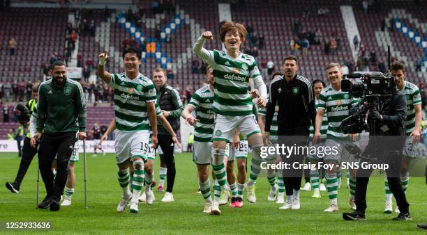 Celtic's Kyogo Furuhashi celebrates at full time after securing the league title during a cinch Premiership match between Heart of Midlothian and...