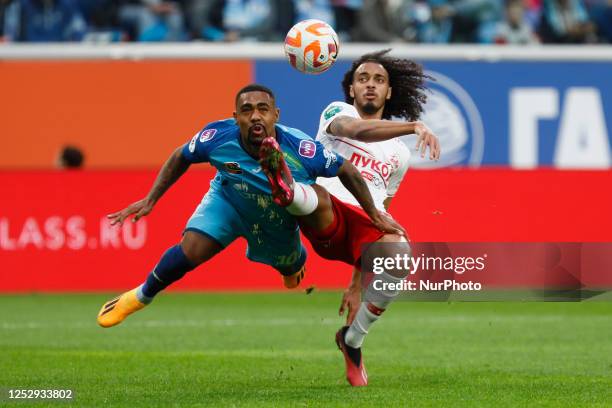 Malcom of Zenit St. Petersburg and Tomas Tavares of Spartak Moscow vie for the ball during the Russian Premier League match between FC Zenit Saint...