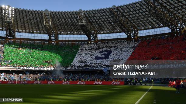 Fans form an Italian flag reading "3" for SSC Napoli's third Scudetto championship title, prior to the Italian Serie A football match between SSC...