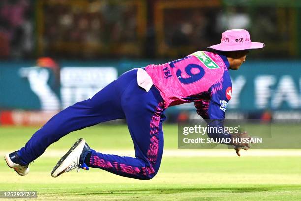 Rajasthan Royals' Yashasvi Jaiswal dives to field the ball during the Indian Premier League Twenty20 cricket match between Rajasthan Royals and...