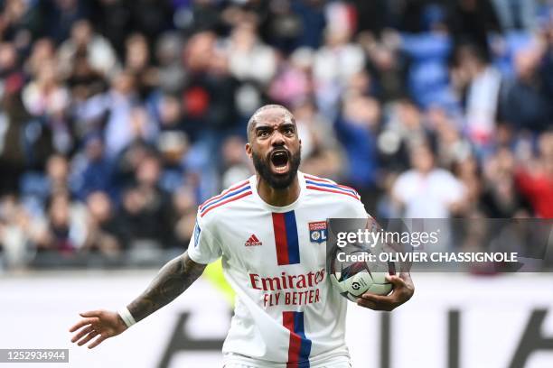 Lyon's French forward Alexandre Lacazette reacts after scoring a goal during the French L1 football match between Olympique Lyonnais and Montpellier...