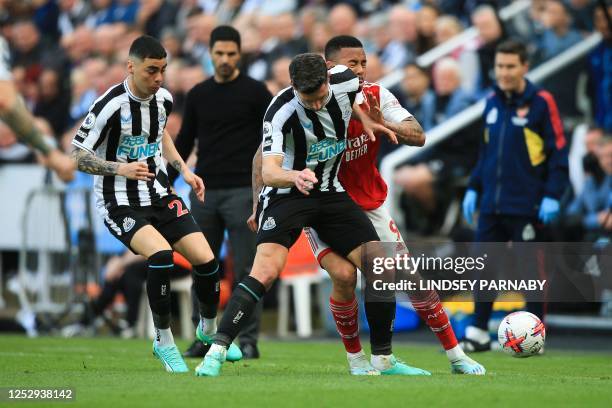 Newcastle United's Swiss defender Fabian Schar fights for the ball with Arsenal's Brazilian striker Gabriel Jesus during the English Premier League...