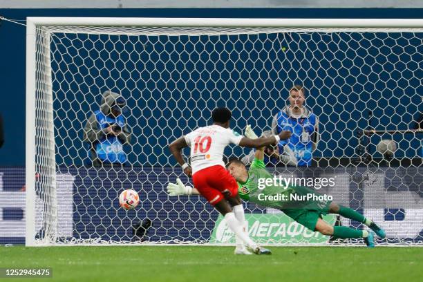 Quincy Promes of Spartak Moscow scores a penalty shot past Mikhail Kerzhakov of Zenit St. Petersburg during the Russian Premier League match between...