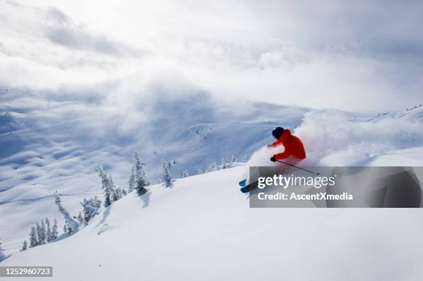 skiing fresh powder on a ski vacation - whistler village stock pictures, royalty-free photos & images