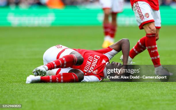 Arsenal's Bukayo Saka lays injured during the Premier League match between Newcastle United and Arsenal FC at St. James Park on May 7, 2023 in...