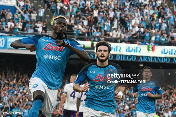 Napoli's Nigerian forward Victor Osimhen celebrates after scoring a penalty to open the scoring during the Italian Serie A football match between SSC...