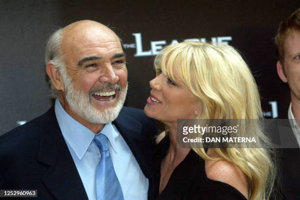 Scottish film veteran Sean Connery jokes with his co-star Peta Wilson 12 August 2003 at a Prague movie theatre for a special screening of his latest...