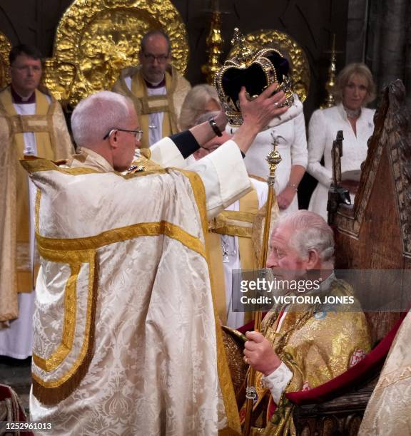 The Archbishop of Canterbury Justin Welby places the St Edward's Crown onto the head of Britain's King Charles III during the Coronation Ceremony...