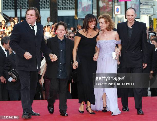 French actor Gerard Depardieu arrives at the Palais des festival with Antoine and Sylvie Pialat , and actress Sandrine Bonnaire and her husband,...