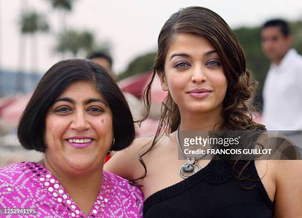 Indian actress and jury member Aishwarya Rai poses for photographers with Indian director and screenwriter Gurinder Chadha on Cannes beach during a...