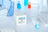 Quick novel COVID-19 coronavirus test kit. 2019 nCoV pcr diagnostics kit. Hand in glove with the box. The kit detects covid19 virus. Тest system for real-time quantitative PCR amplification.