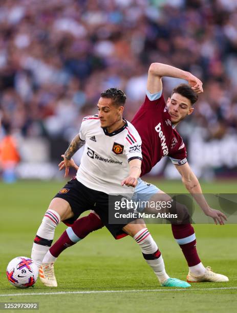 Antony of Manchester United in action with Declan Rice of West Ham during the Premier League match between West Ham United and Manchester United at...