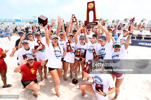 The USC Trojans celebrate after defeating the UCLA Bruins during the Division I Women's Beach Volleyball Championship held at Gulf Shores Public...