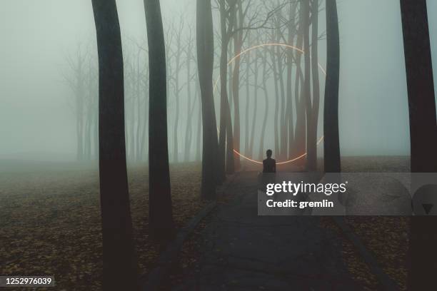 fantasy rural road with woman standing - dark country road stock pictures, royalty-free photos & images