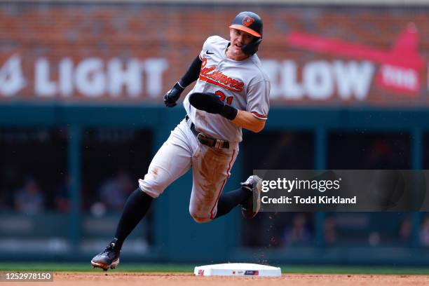 Austin Hays of the Baltimore Orioles rounds second base on his way to third during the fourth inning against the Atlanta Braves at Truist Park on May...