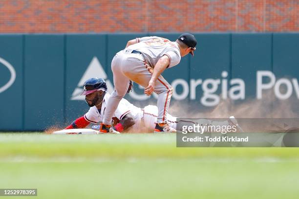 Michael Harris II of the Atlanta Braves steals second base as Adam Frazier of the Baltimore Orioles is late with the tag during the tenth inning at...