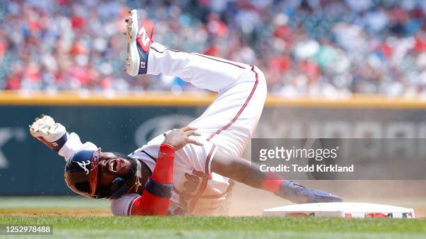 Michael Harris II of the Atlanta Braves reacts after being tagged out at third by Ramon Urias of the Baltimore Orioles during the tenth inning at...