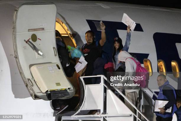 Migrants enter the plane of the Venezuelan airline Estelar, which repatriated 126 Venezuelan citizens who were stranded on the Chilean-Peruvian...