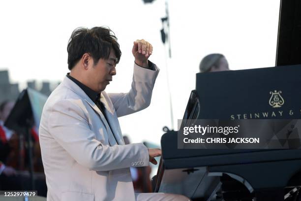 Chinese pianist Lang Lang performs inside Windsor Castle grounds at the Coronation Concert, in Windsor, west of London on May 7, 2023. - For the...