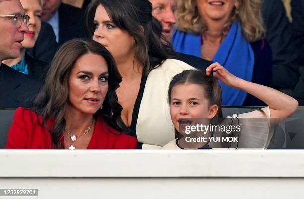 Britain's Catherine, Princess of Wales , and her daughter Britain's Princess Charlotte of Wales attend the Coronation Concert at Windsor Castle in...