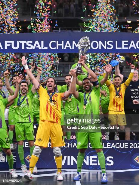 Carlos Barrón, left, and Francisco Tomaz of Mallorca Palma Futsal lift the trophy after the UEFA Futsal Champions League Final 2022/23 match between...