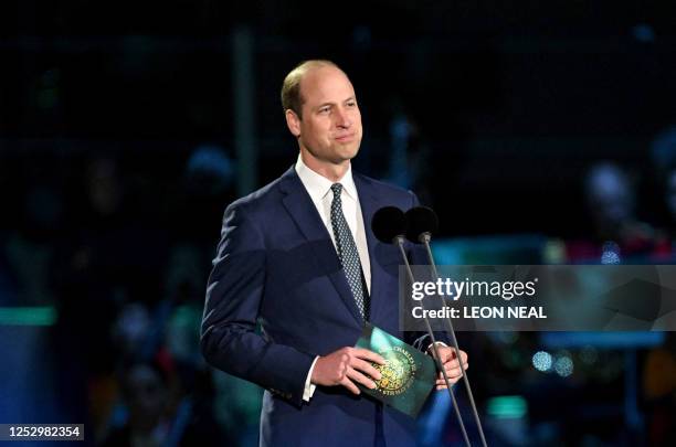 Britain's Prince William, Prince of Wales speaks on stage inside Windsor Castle grounds at the Coronation Concert, in Windsor, west of London on May...