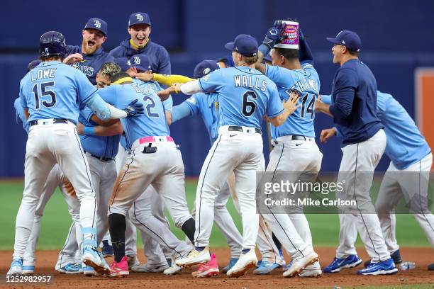 Members of the Tampa Bay Rays celebrate a win over the New York Yankees during the 10th inning of a baseball game at Tropicana Field on May 7, 2023...