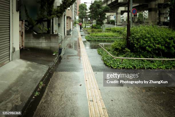 tokyo city street in the rain. - shitamachi stock pictures, royalty-free photos & images